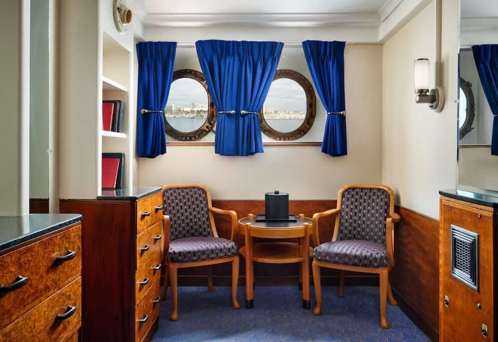Harbor View Deluxe King Sitting Area Photo Credit: The Queen Mary