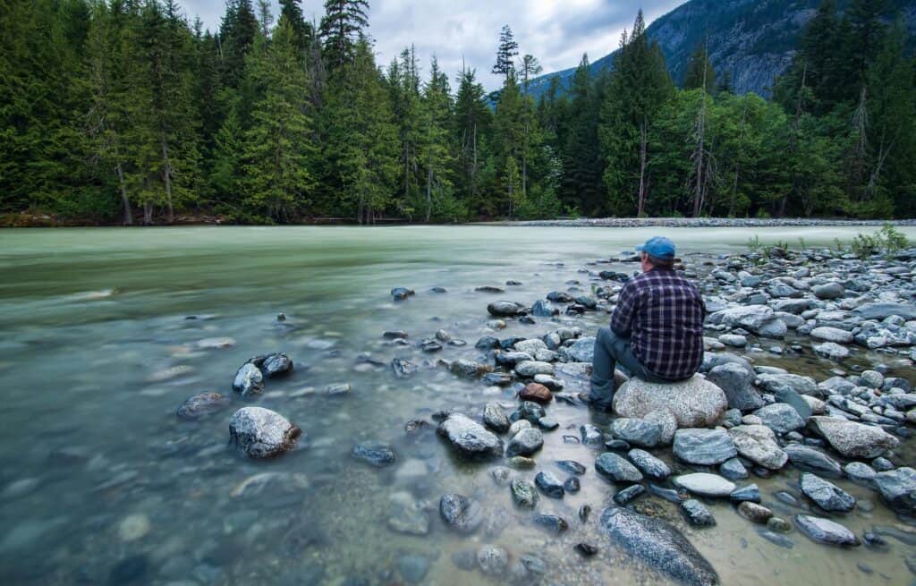 Man fishing for rest and recovery relaxation